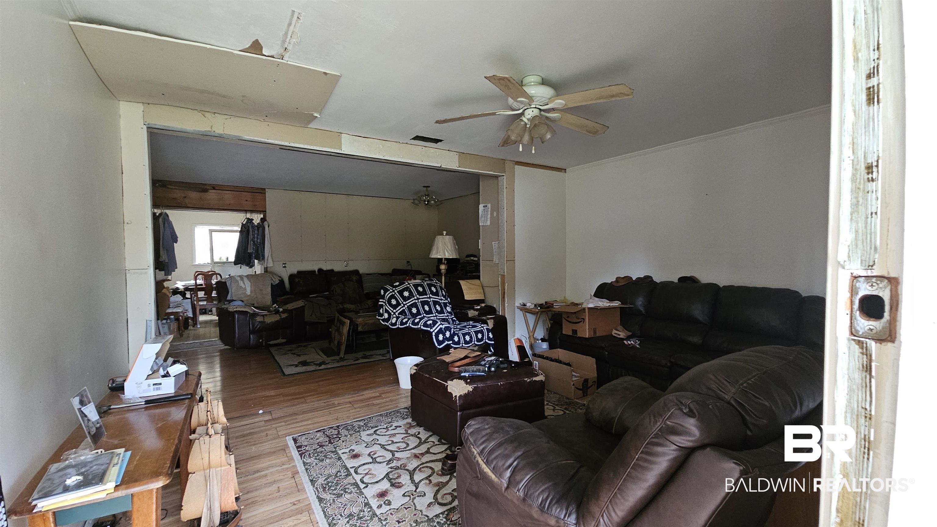 216 6th Avenue Atmore, AL 36502 - Photo 3 of 34 Living room featuring hardwood / wood-style floors, ceiling fan, and ornamental molding