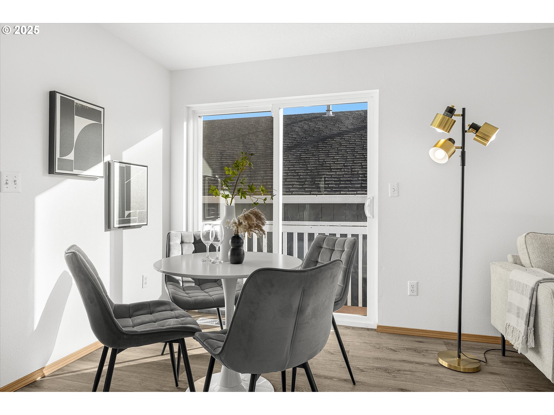 14029 Southeast Summerfield Loop Happy Valley, OR 97086 - Photo 18 of 47 a view of a dining room with furniture window and wooden floor