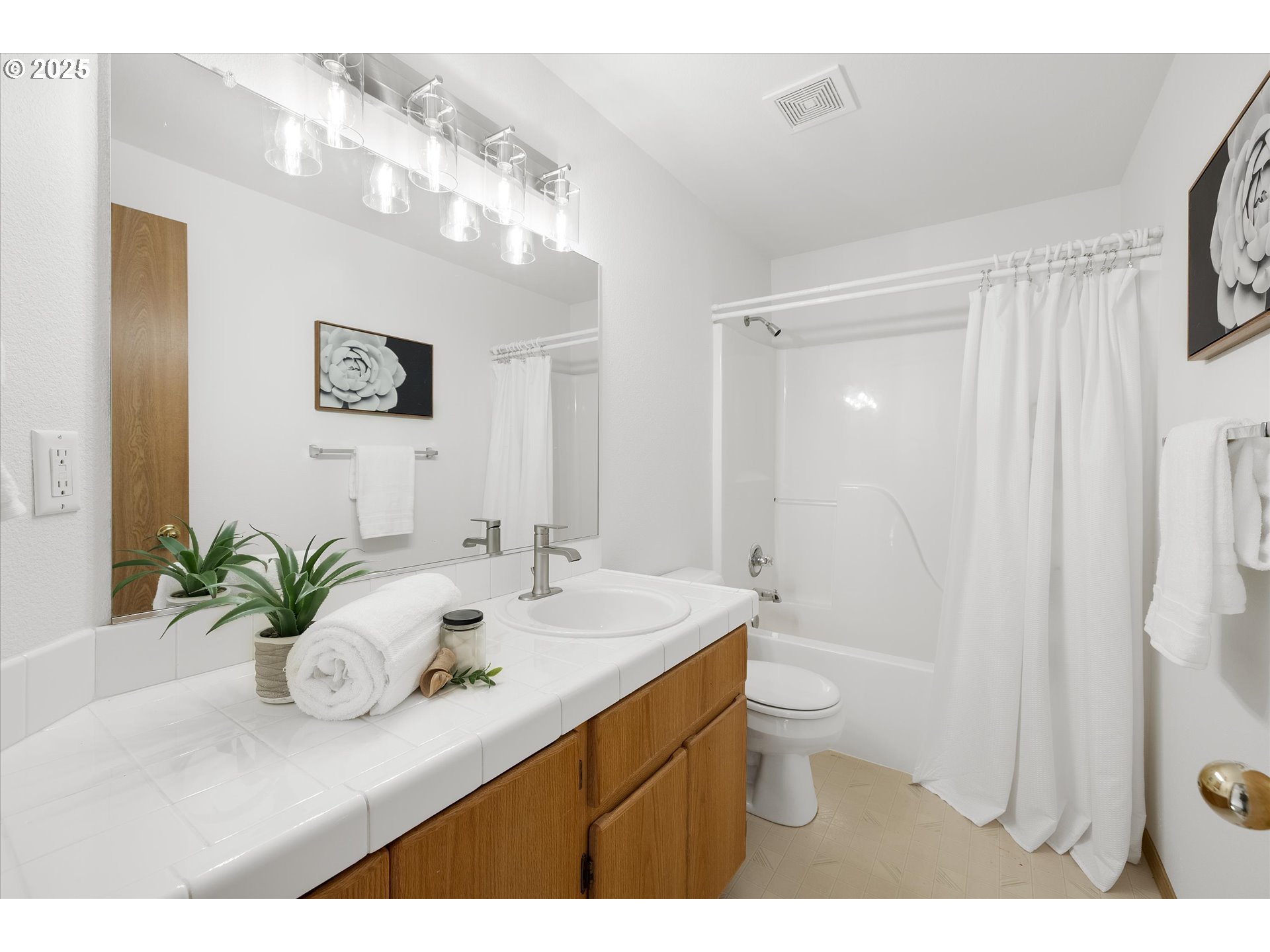 14029 Southeast Summerfield Loop Happy Valley, OR 97086 - Photo 24 of 47 a bathroom with a sink a toilet and a large mirror