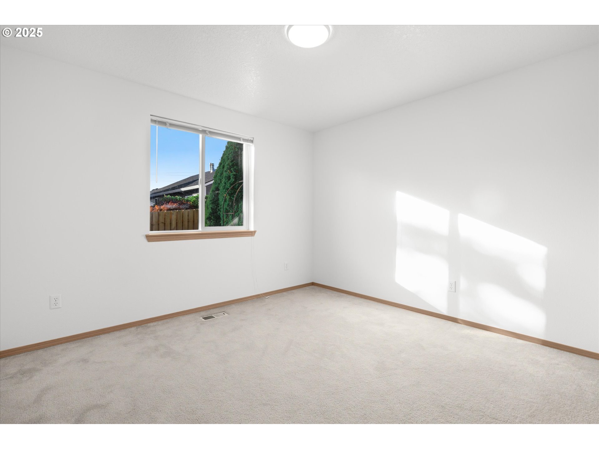 14029 Southeast Summerfield Loop Happy Valley, OR 97086 - Photo 26 of 47 a view of an empty room with a window