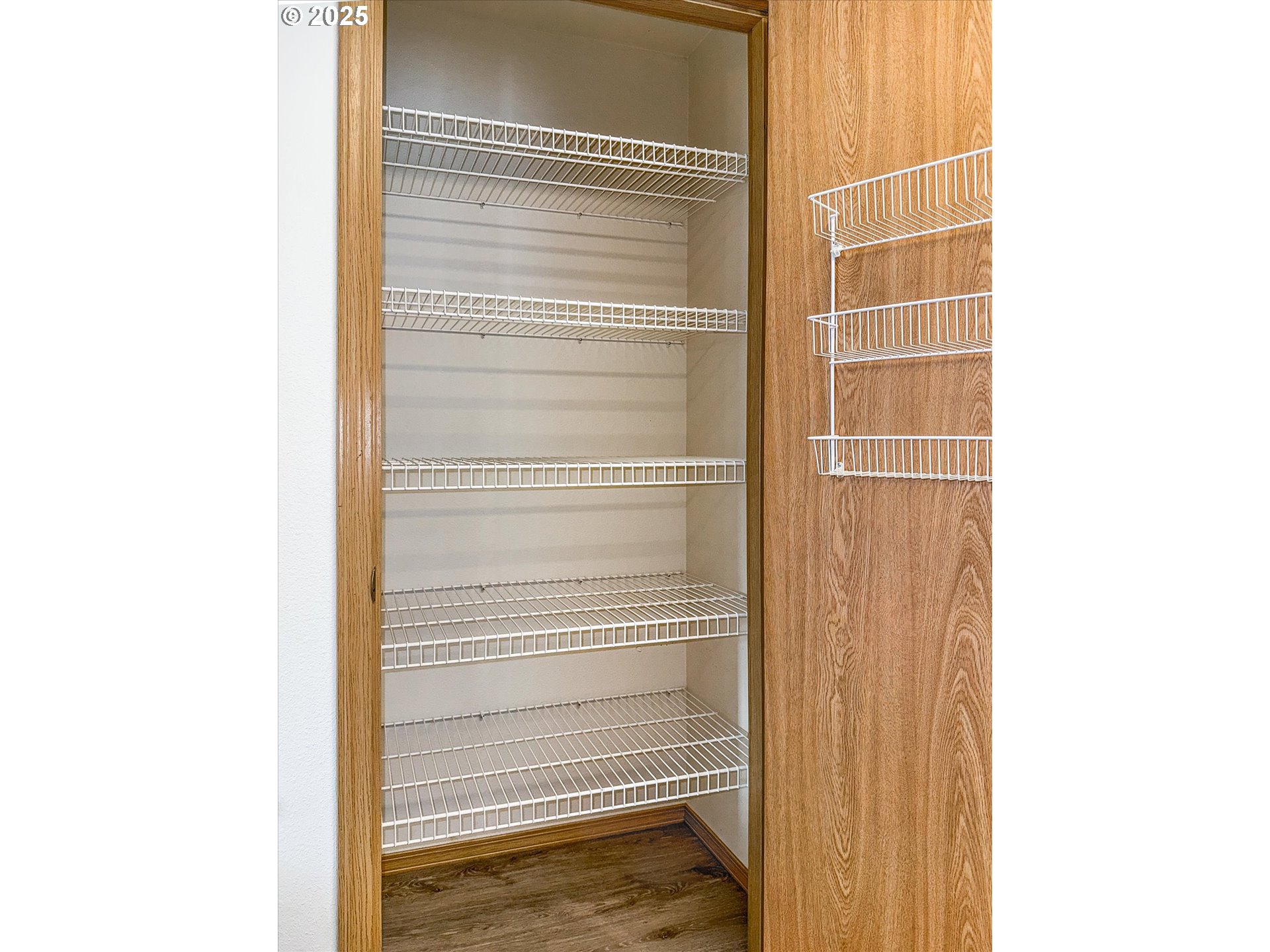 14029 Southeast Summerfield Loop Happy Valley, OR 97086 - Photo 28 of 47 a view of walk in closet with empty racks