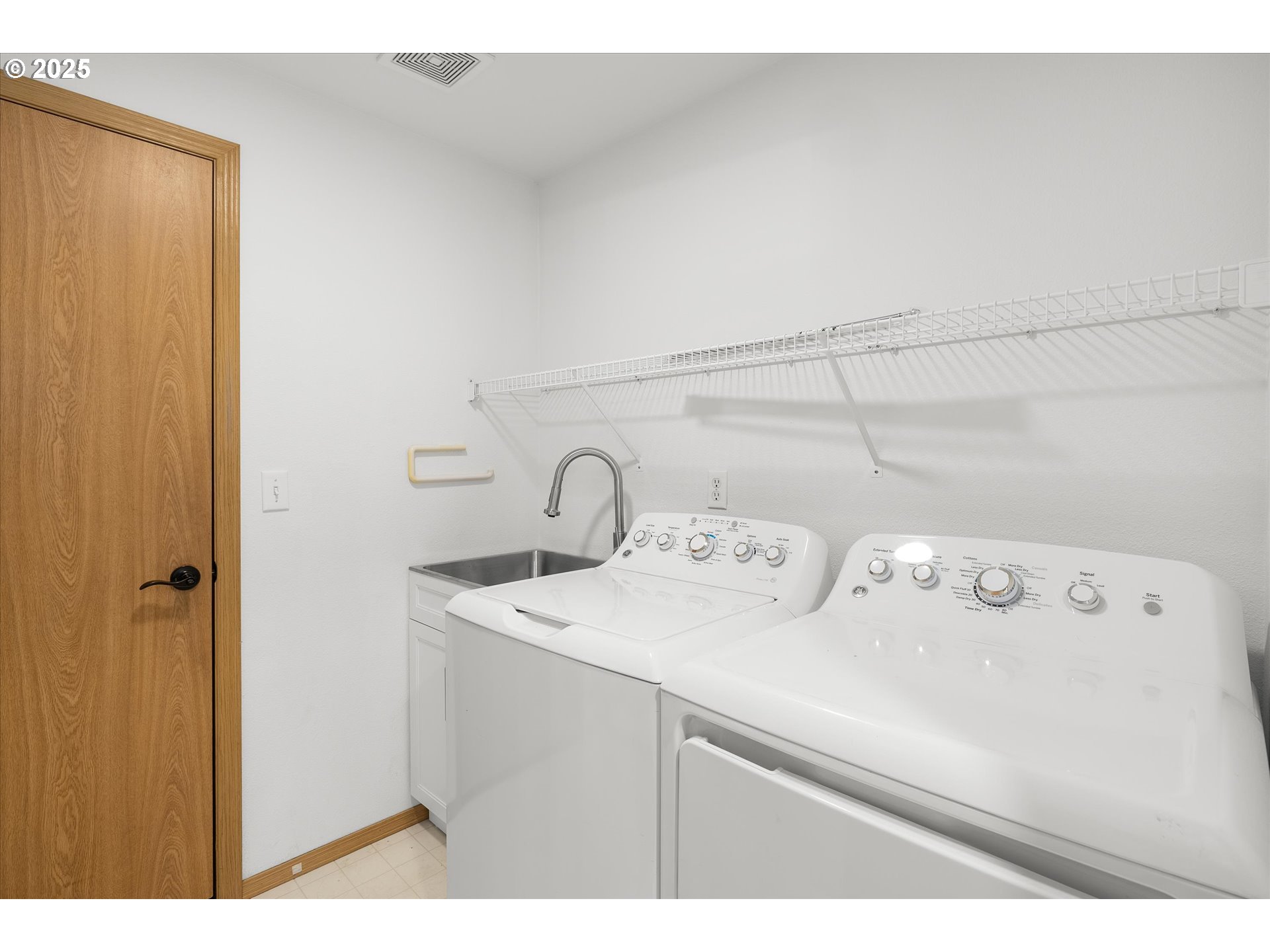 14029 Southeast Summerfield Loop Happy Valley, OR 97086 - Photo 29 of 47 a utility room with dryer and washer