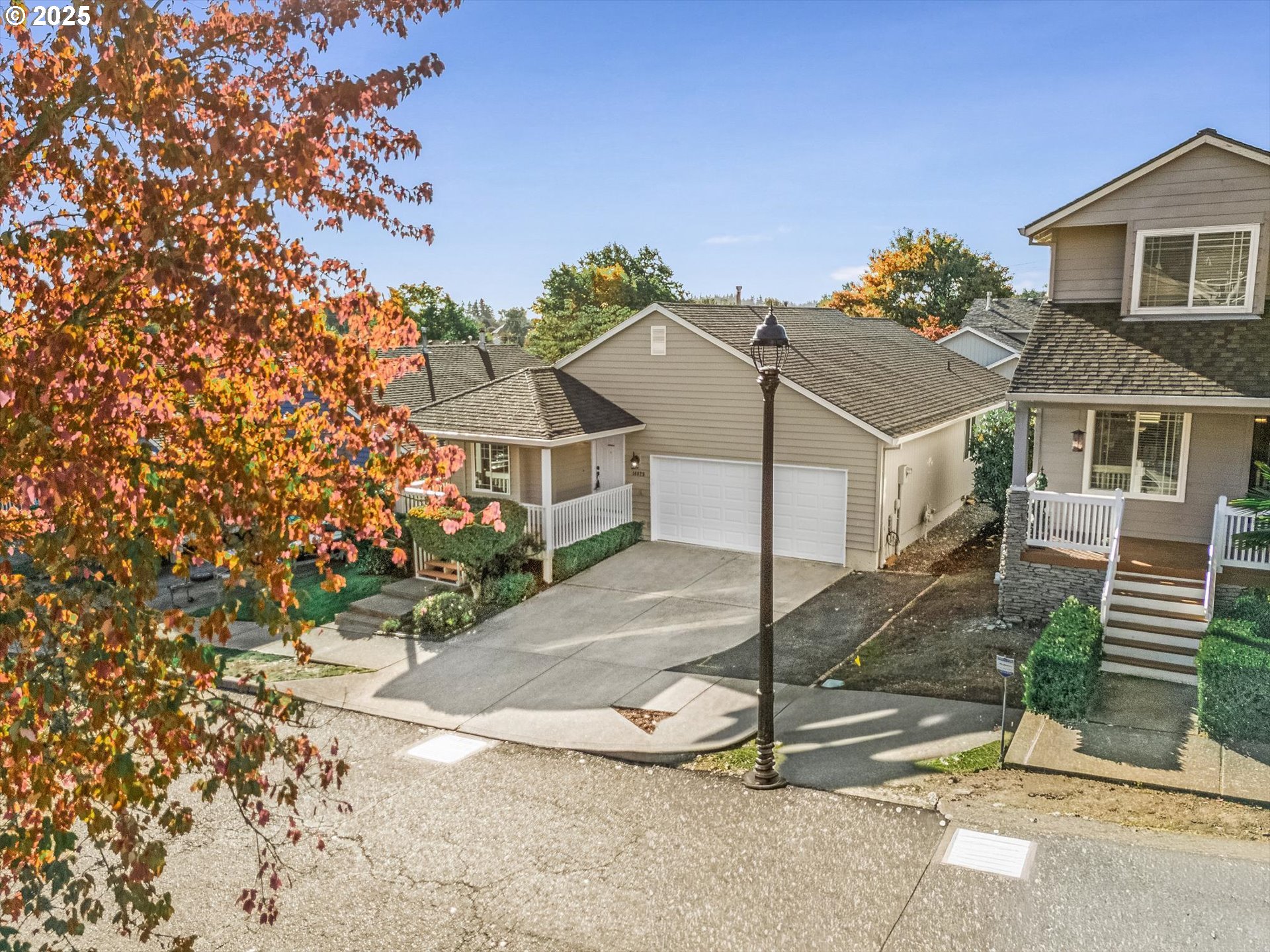 14029 Southeast Summerfield Loop Happy Valley, OR 97086 - Photo 5 of 47 a house with a tree in front of it