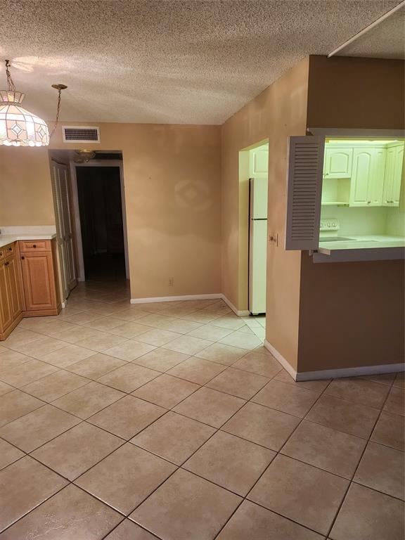 104 Westbury East, Unit 104 Deerfield Beach, FL 33442 - Photo 14 of 40 an empty room with windows