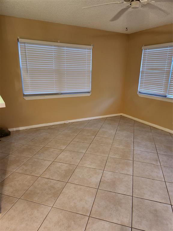 104 Westbury East, Unit 104 Deerfield Beach, FL 33442 - Photo 16 of 40 a view of an empty room with a window