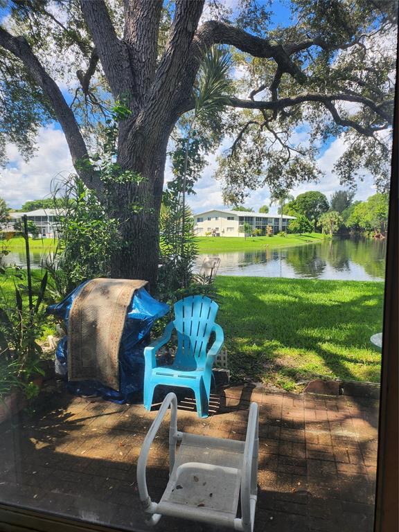 104 Westbury East, Unit 104 Deerfield Beach, FL 33442 - Photo 2 of 40 a view of a swimming pool with a patio