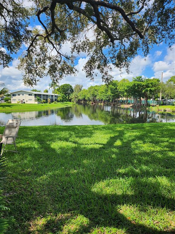 104 Westbury East, Unit 104 Deerfield Beach, FL 33442 - Photo 25 of 40 a view of swimming pool with a yard