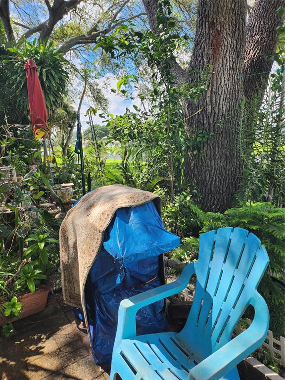 104 Westbury East, Unit 104 Deerfield Beach, FL 33442 - Photo 26 of 40 a view of a backyard with sitting area and furniture