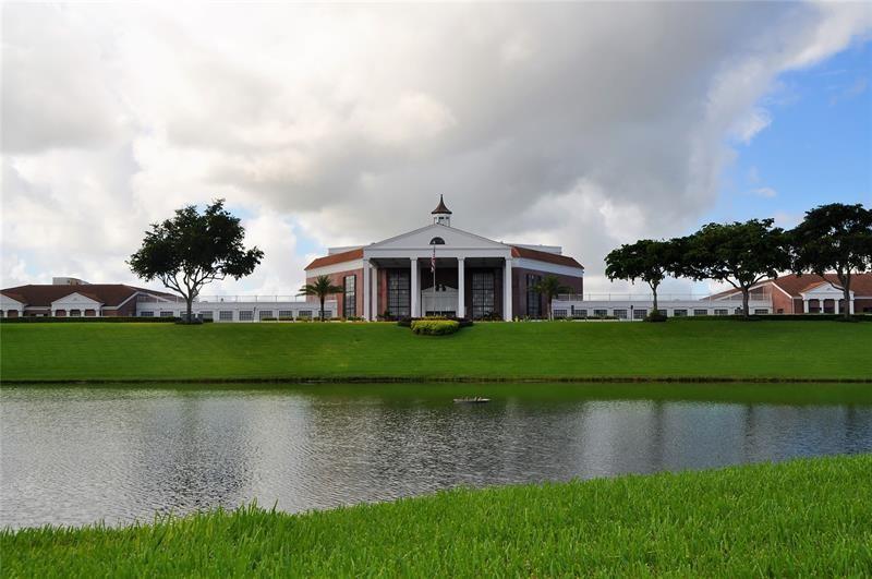 104 Westbury East, Unit 104 Deerfield Beach, FL 33442 - Photo 38 of 40 a front view of a house with a yard
