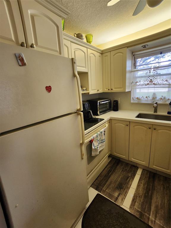 104 Westbury East, Unit 104 Deerfield Beach, FL 33442 - Photo 10 of 40 a utility room with dryer and washer