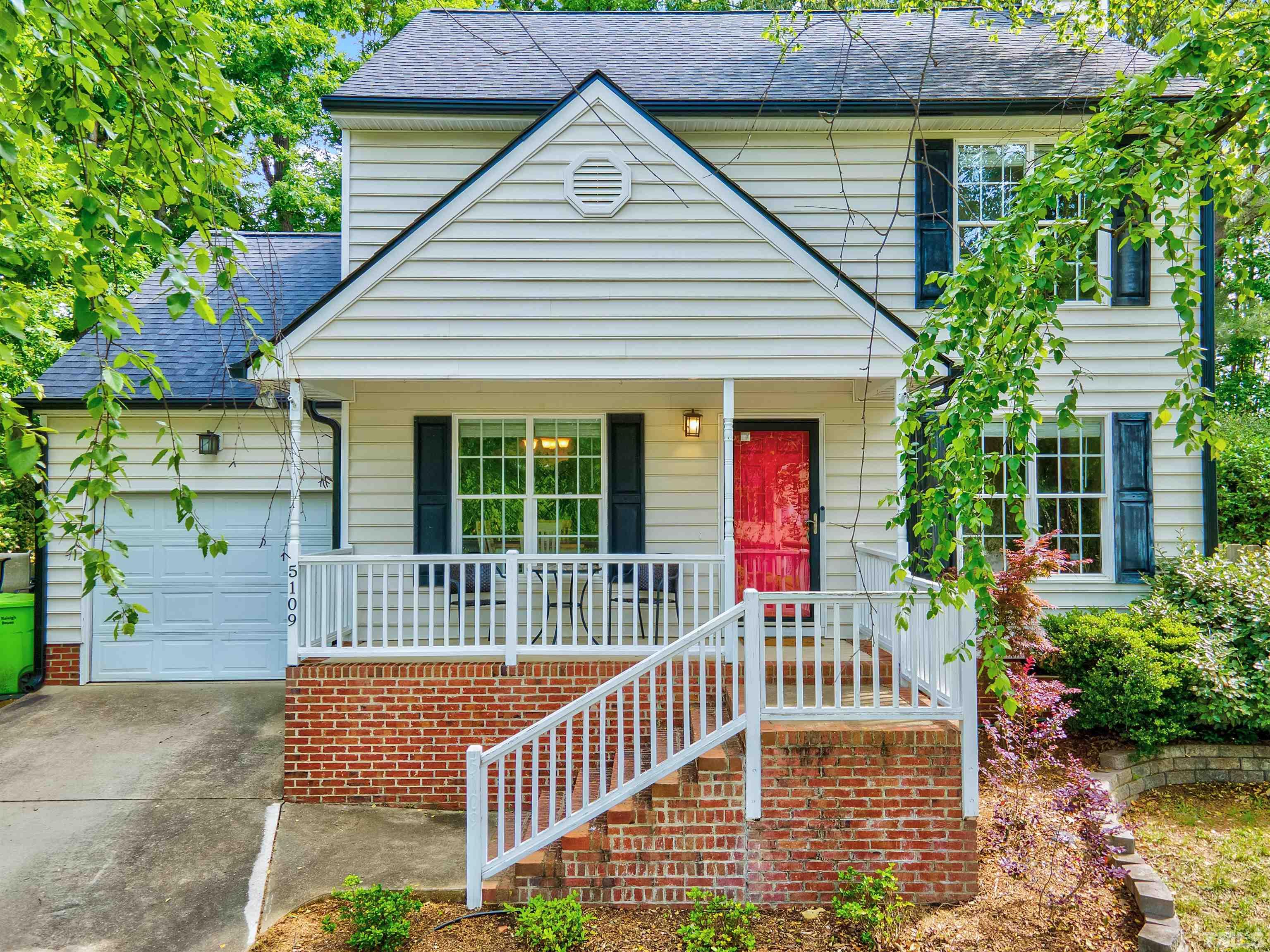 5109 Antler Ridge Court Raleigh, NC 27616 - Photo 1 of 30 a front view of a house with a porch