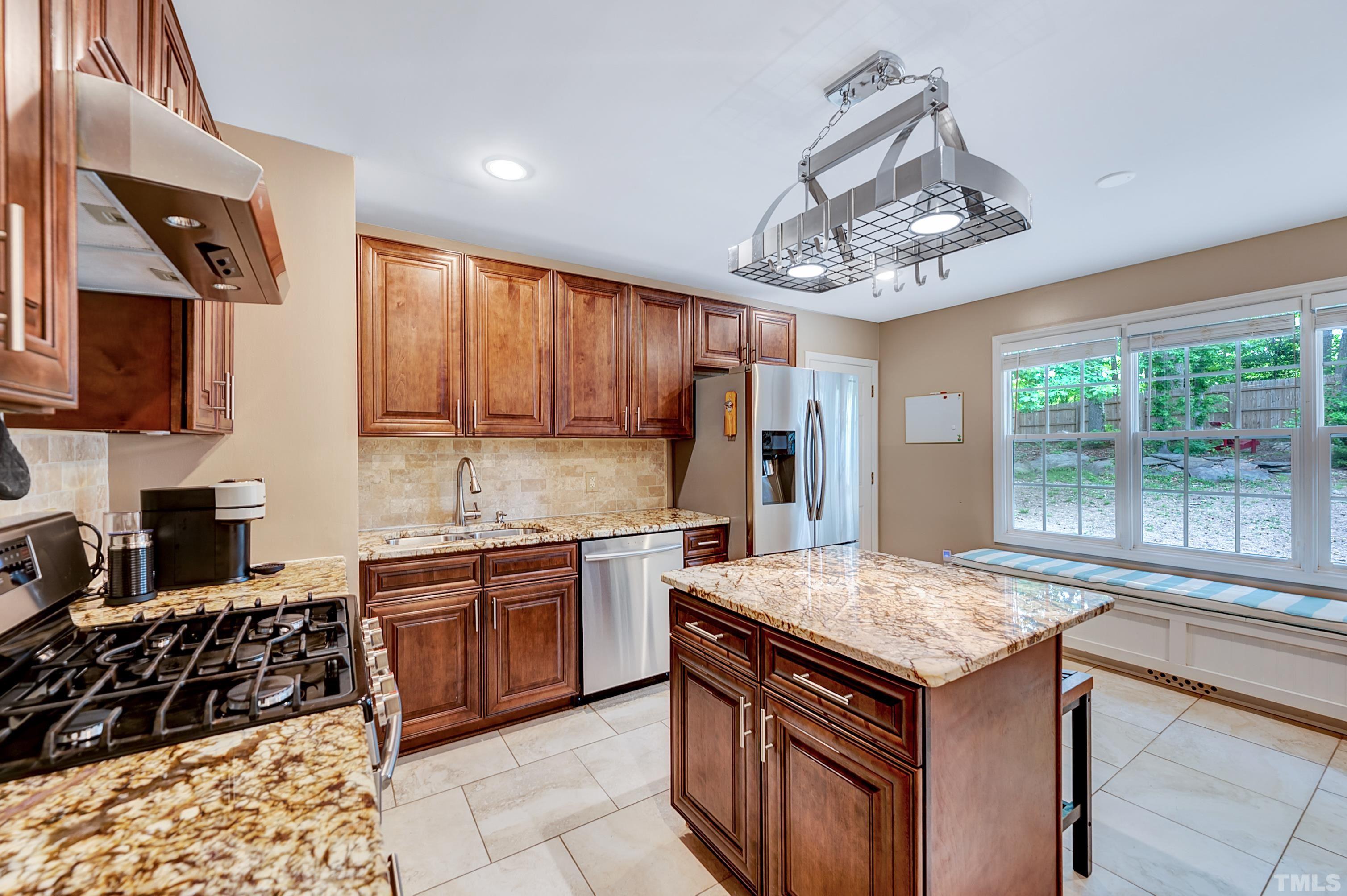 5109 Antler Ridge Court Raleigh, NC 27616 - Photo 15 of 30 a kitchen with stainless steel appliances granite countertop a sink stove and refrigerator