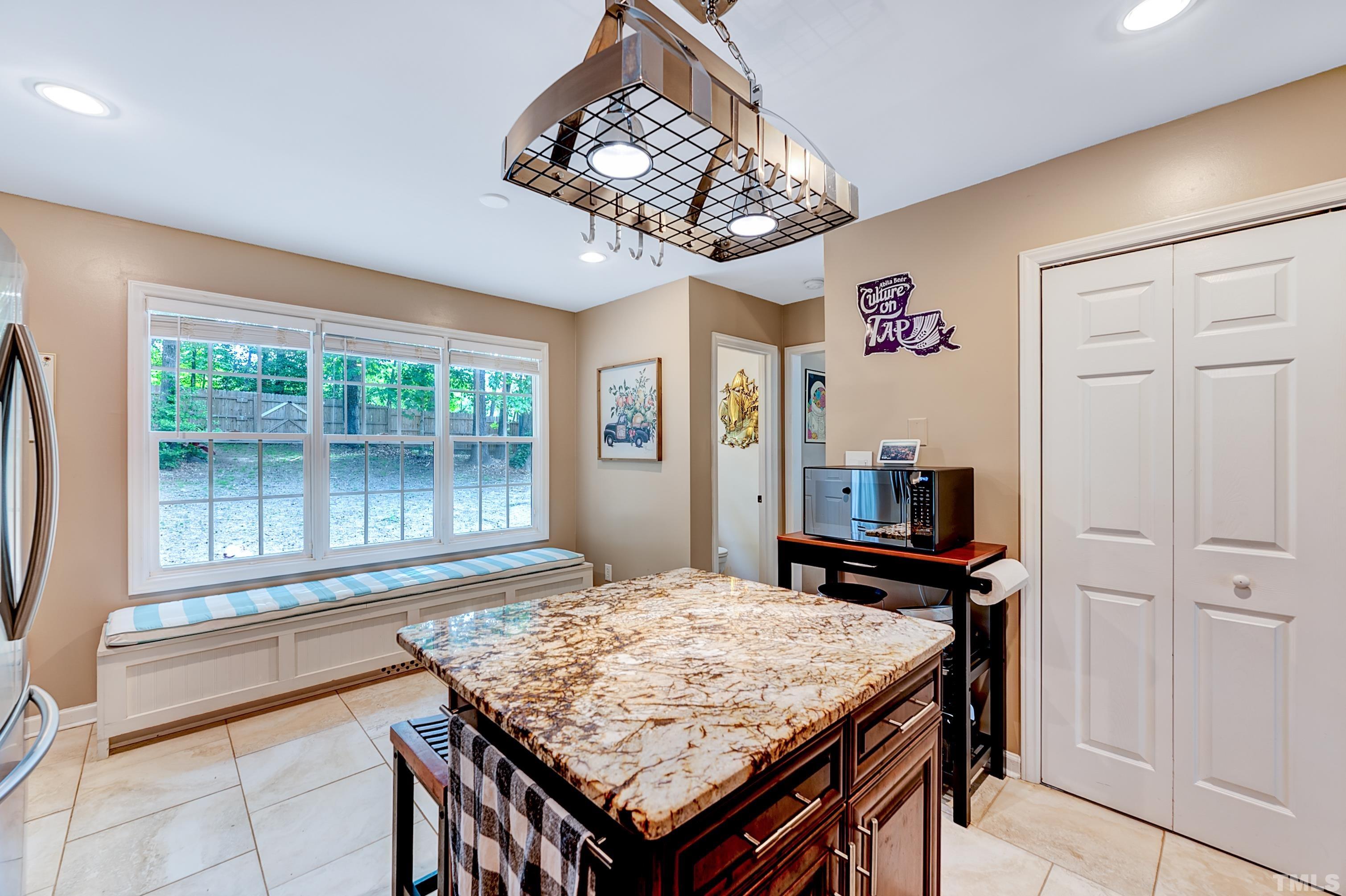 5109 Antler Ridge Court Raleigh, NC 27616 - Photo 16 of 30 a dining room with a table and chairs in it