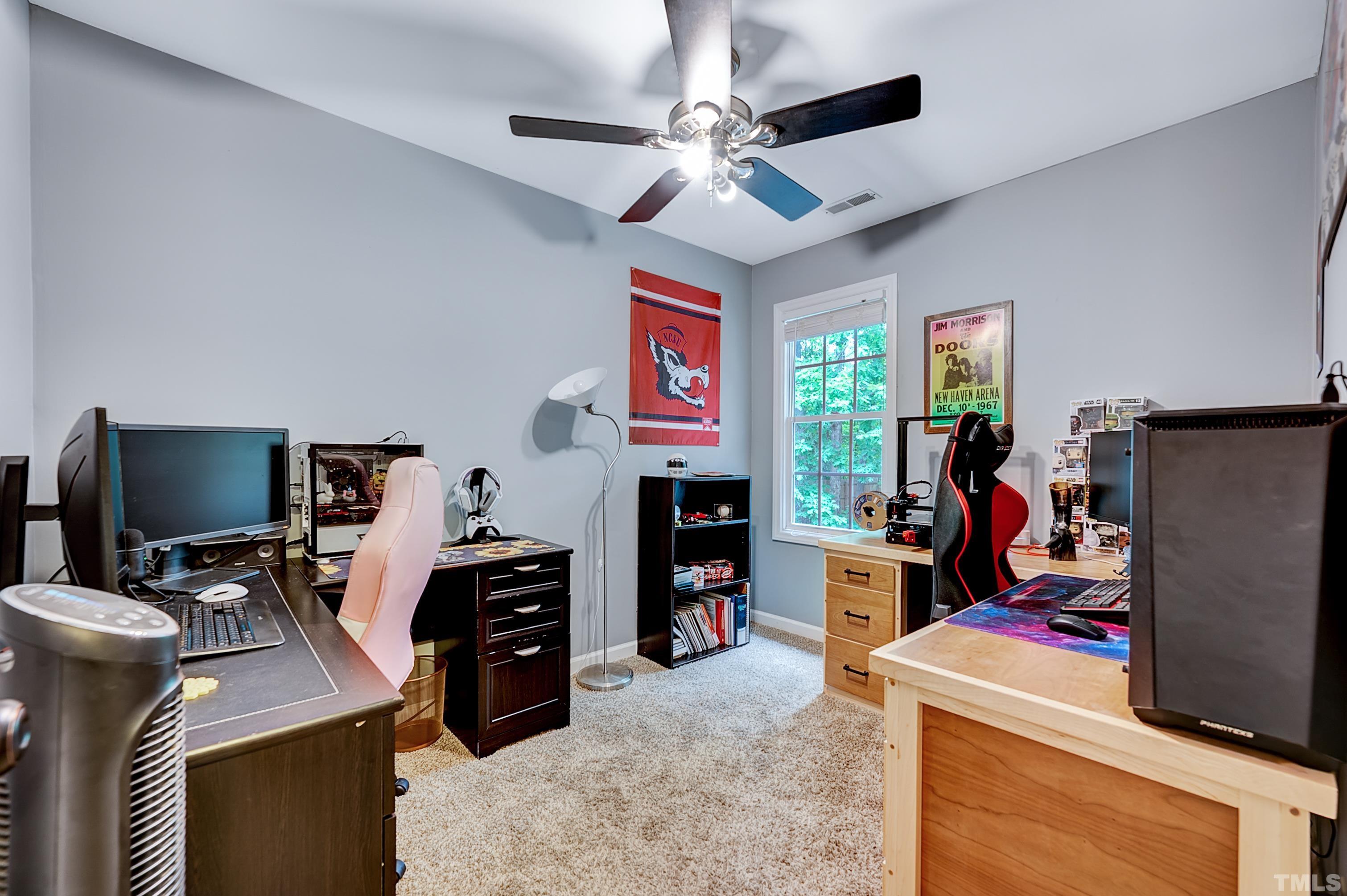 5109 Antler Ridge Court Raleigh, NC 27616 - Photo 20 of 30 a room with furniture and a flat screen tv