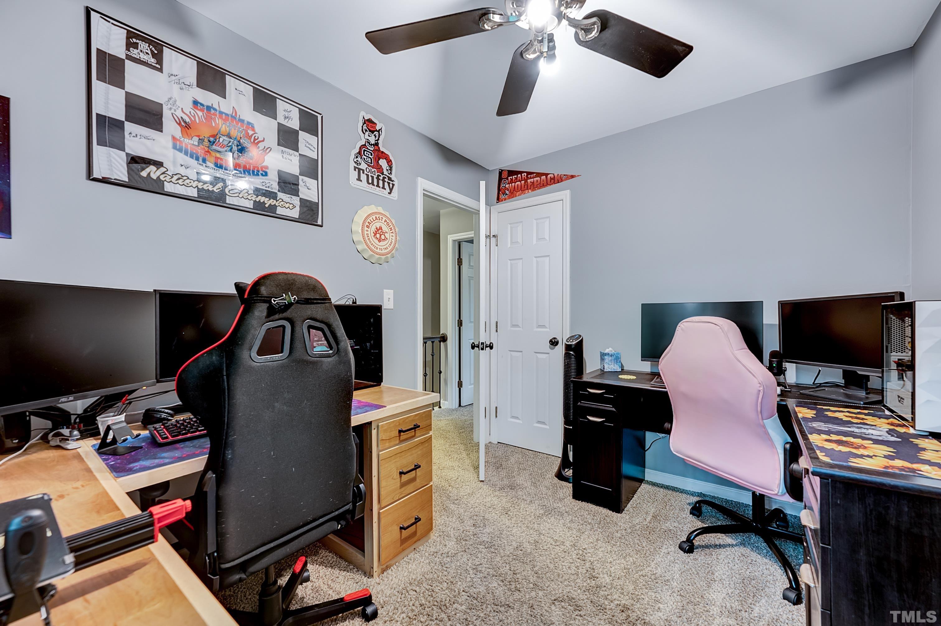 5109 Antler Ridge Court Raleigh, NC 27616 - Photo 21 of 30 a view of a workspace with furniture and a ceiling fan
