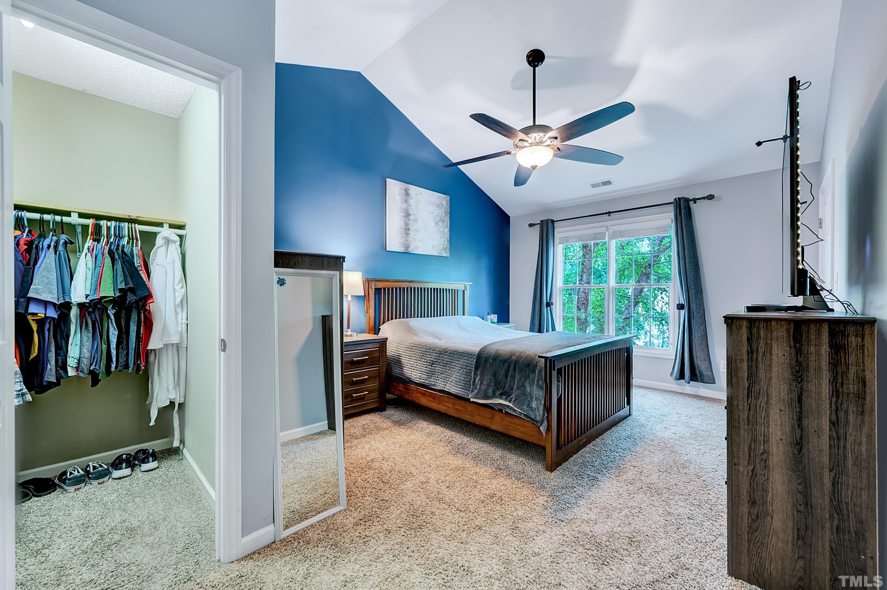 5109 Antler Ridge Court Raleigh, NC 27616 - Photo 22 of 30 a bedroom with a bed and a ceiling fan