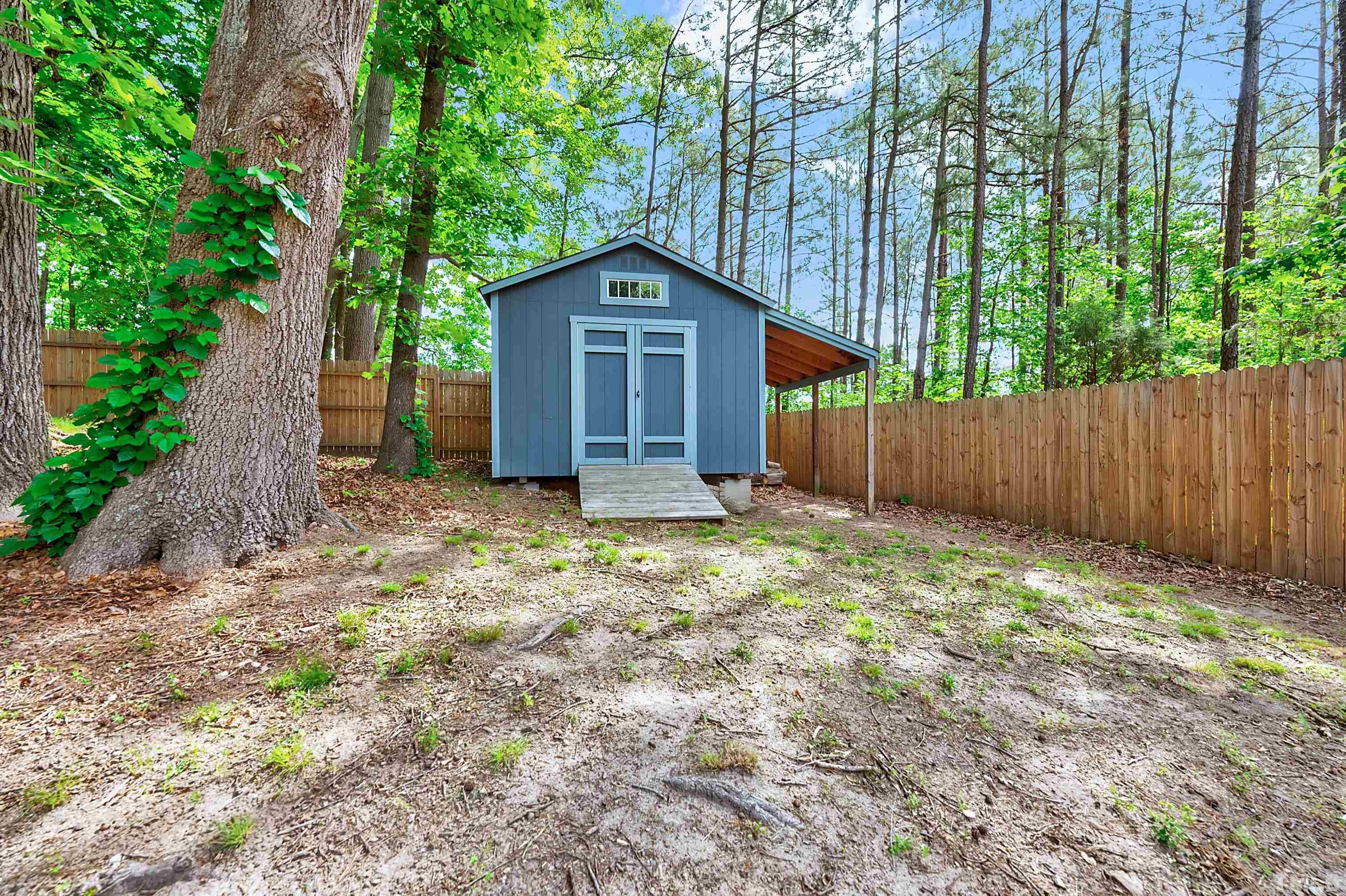 5109 Antler Ridge Court Raleigh, NC 27616 - Photo 29 of 30 a wooden house with trees in the background