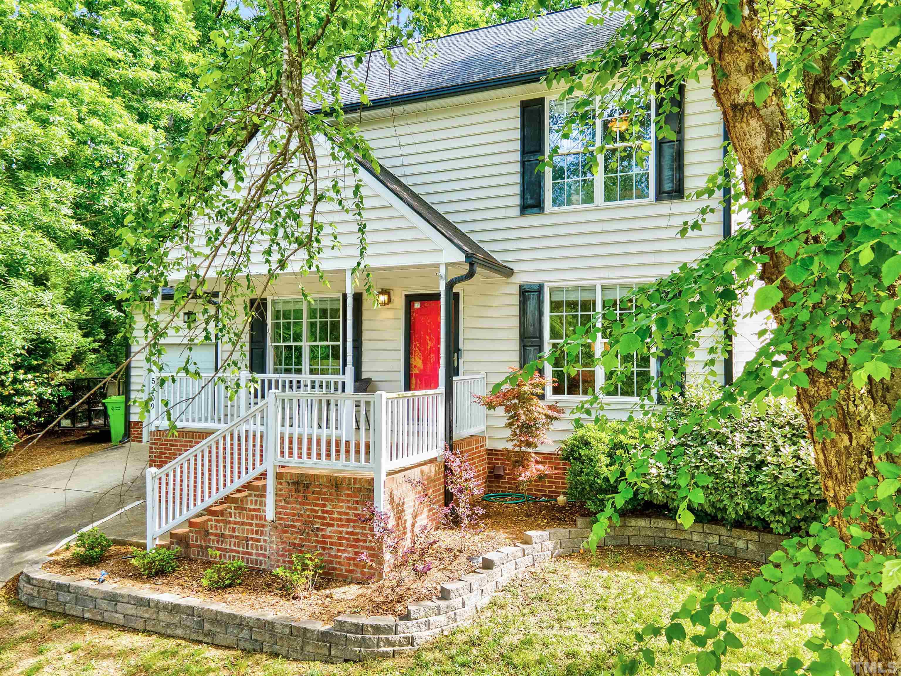 5109 Antler Ridge Court Raleigh, NC 27616 - Photo 3 of 30 a view of house with backyard outdoor seating and green space