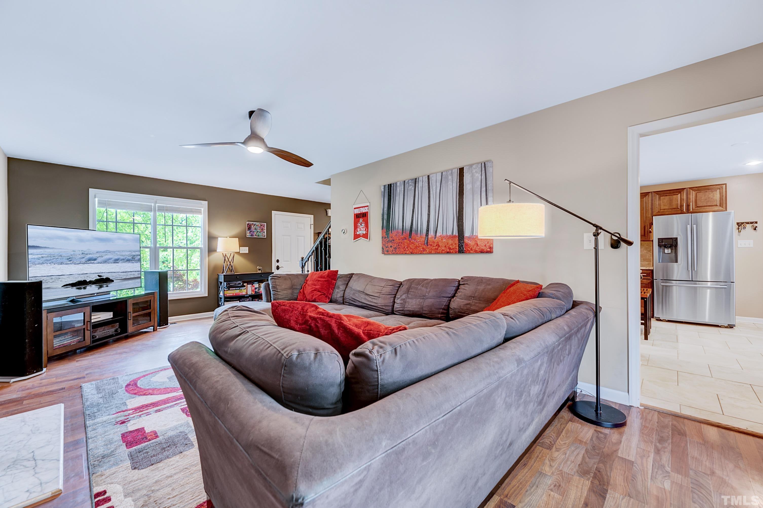 5109 Antler Ridge Court Raleigh, NC 27616 - Photo 10 of 30 a living room with furniture fireplace and a flat screen tv