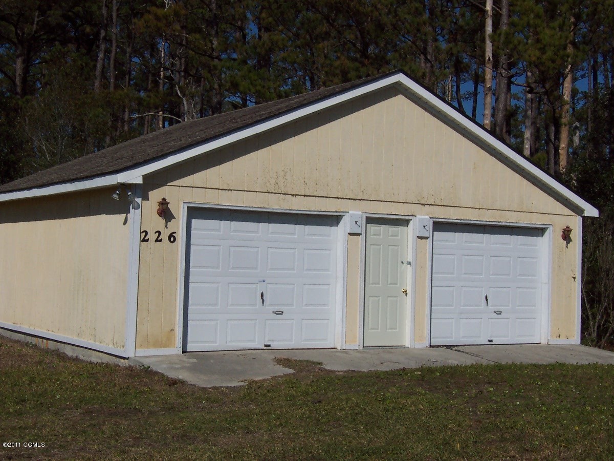 226 Community Road Davis, NC 28524 - Photo 2 of 25 Front of Garage