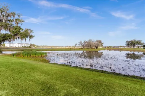 a view of a lake with a big yard