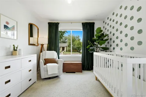 a bedroom with furniture and window