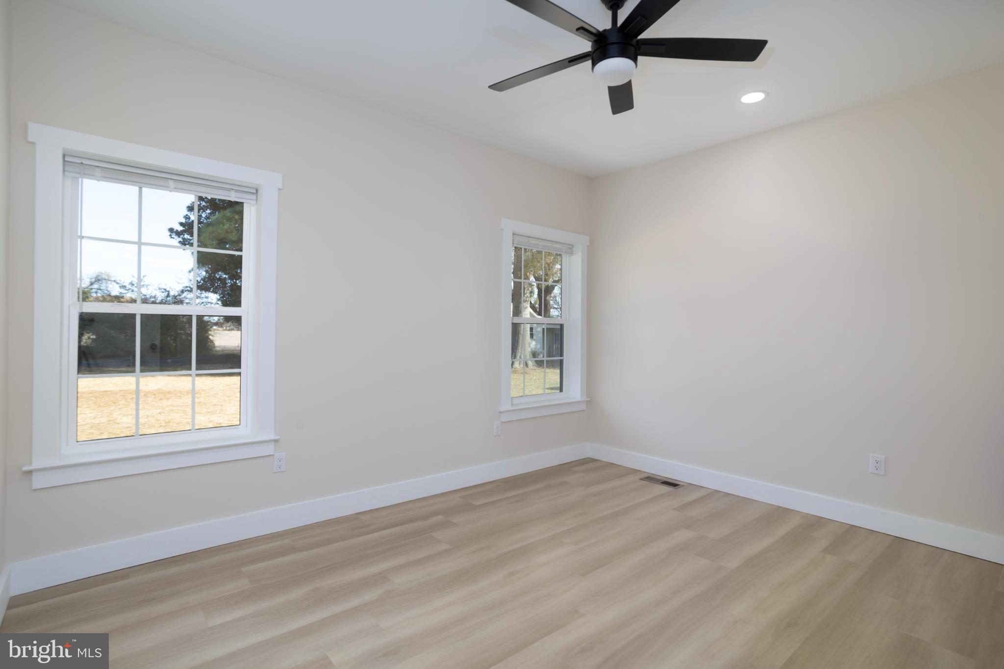 8 Sunrise Avenue Ridgely, MD 21660 - Photo 16 of 23 a view of a room with wooden floor and windows