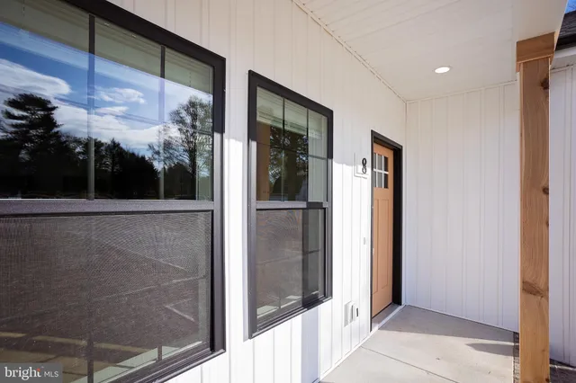 a view of a glass door and a window