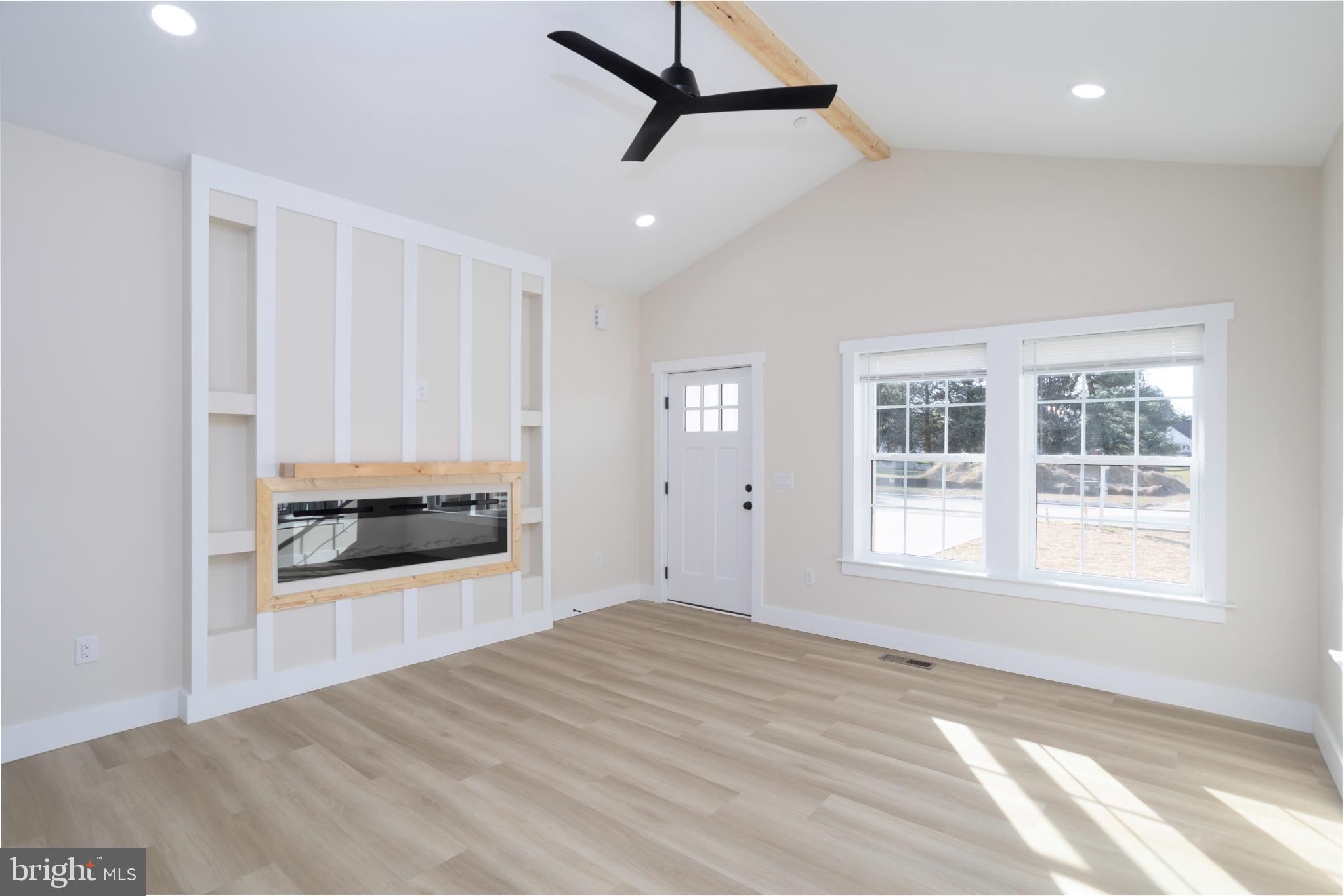 8 Sunrise Avenue Ridgely, MD 21660 - Photo 8 of 23 a view of empty room with a fireplace and wooden floor