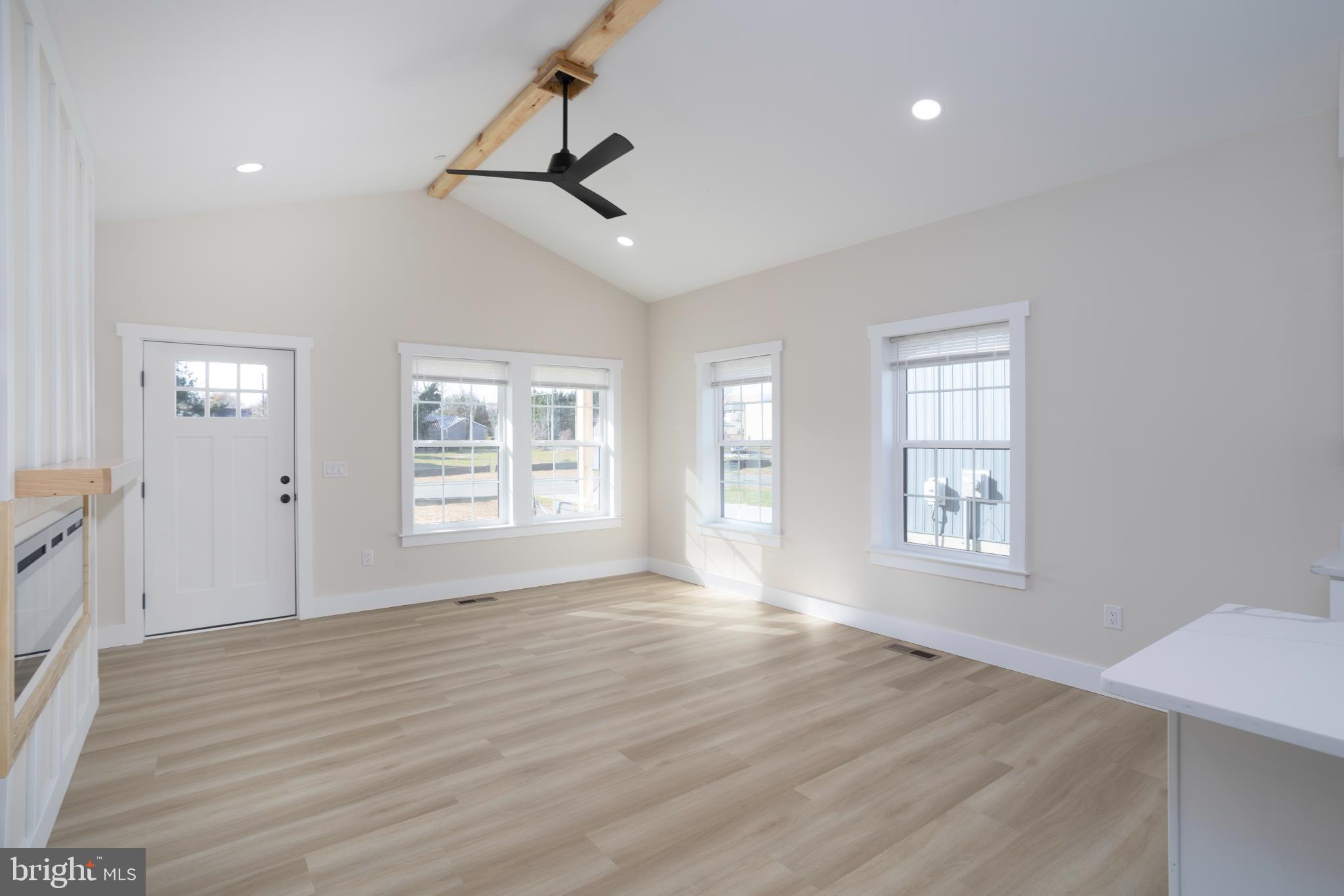 8 Sunrise Avenue Ridgely, MD 21660 - Photo 9 of 23 a view of an empty room with wooden floor and a window