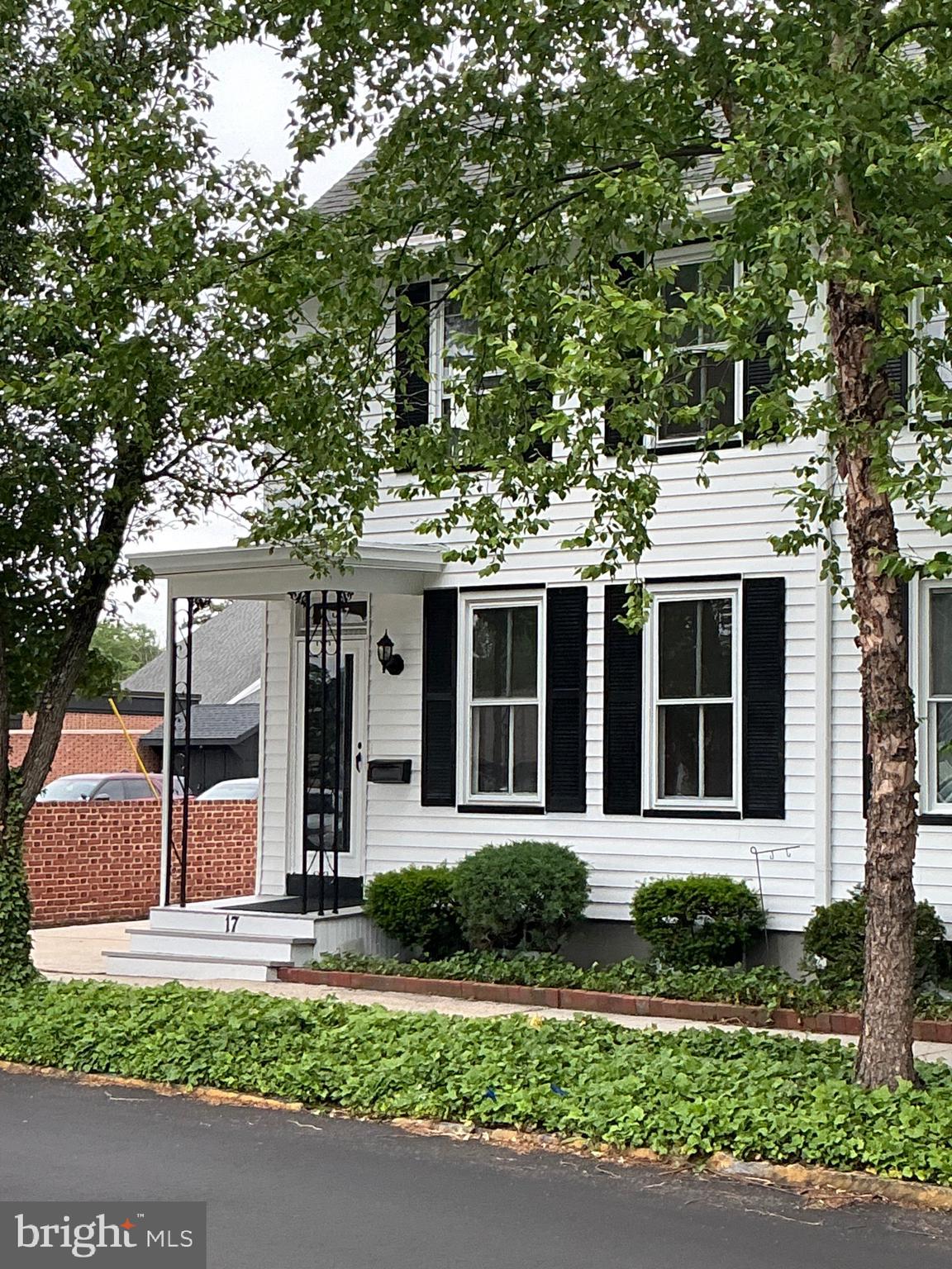 front view of a house with a small yard