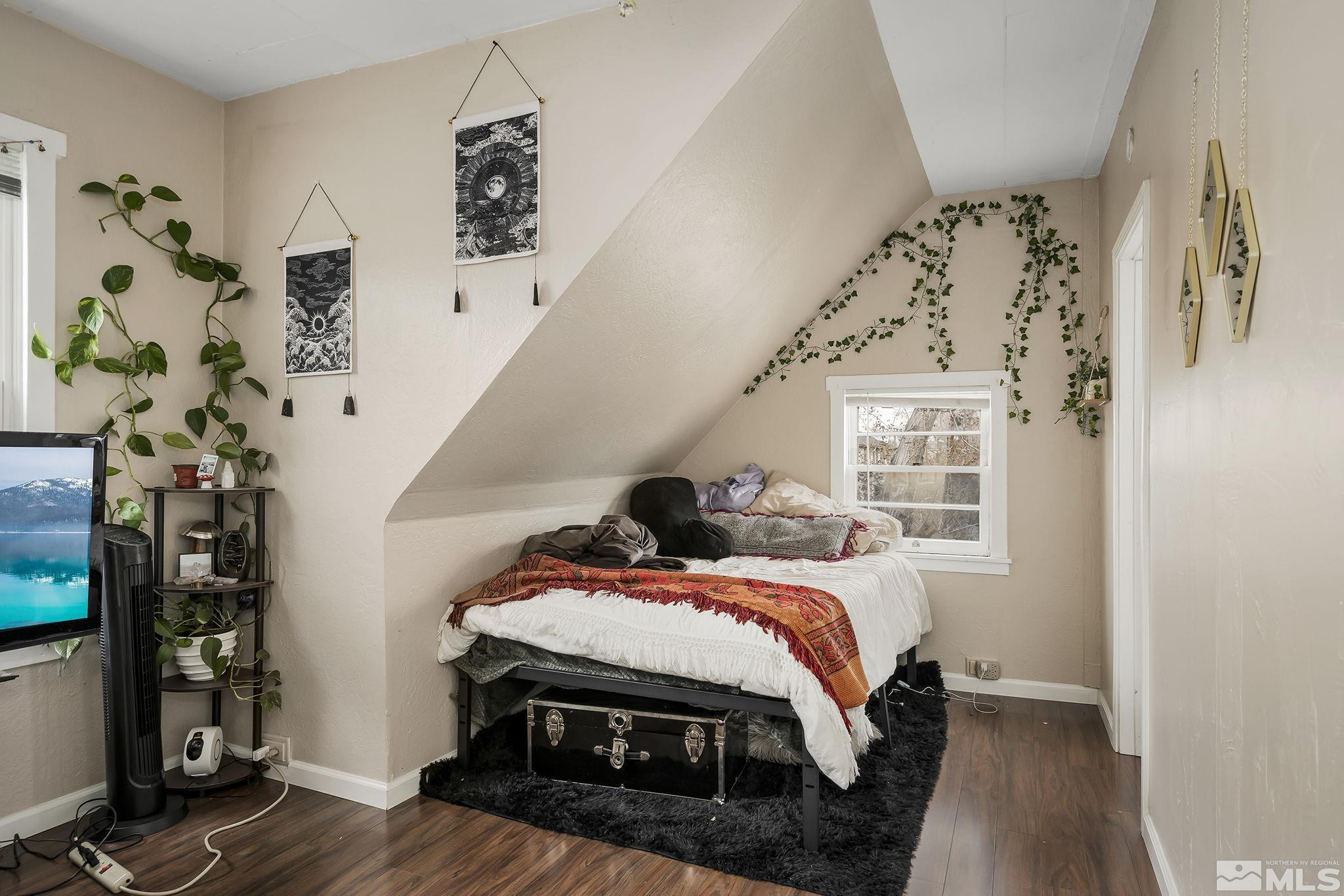 919-915 Bell Street Reno, NV 89503 - Photo 11 of 13 a bedroom with a bed and a window