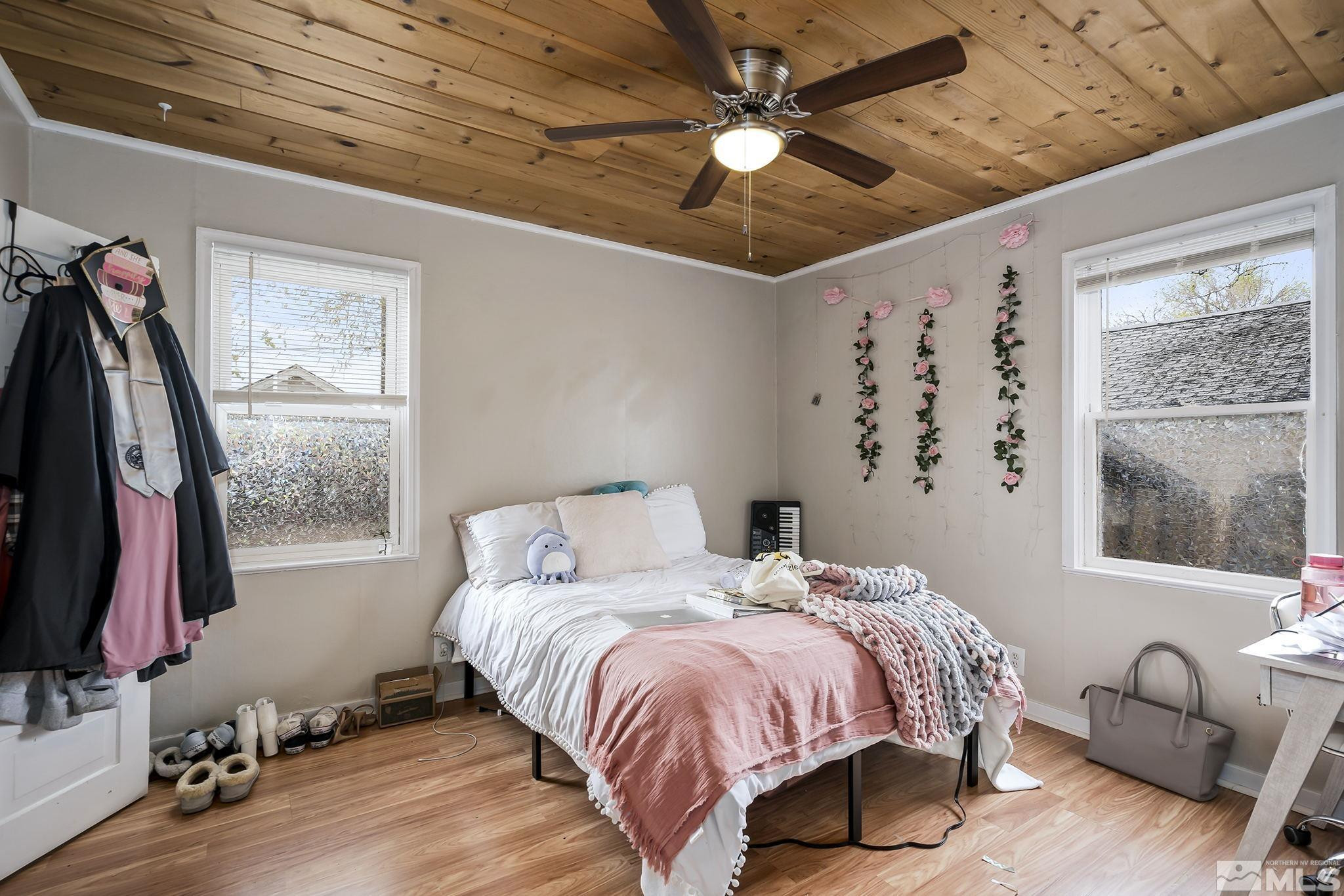 919-915 Bell Street Reno, NV 89503 - Photo 12 of 13 a spacious bedroom with a bed and a window