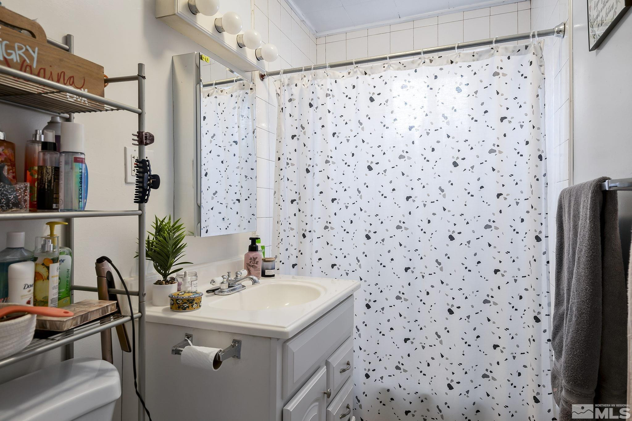919-915 Bell Street Reno, NV 89503 - Photo 13 of 13 a bathroom with a sink toilet and shower