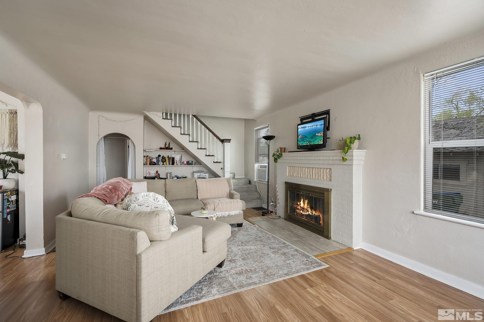 919-915 Bell Street Reno, NV 89503 - Photo 2 of 13 a living room with furniture and a fireplace