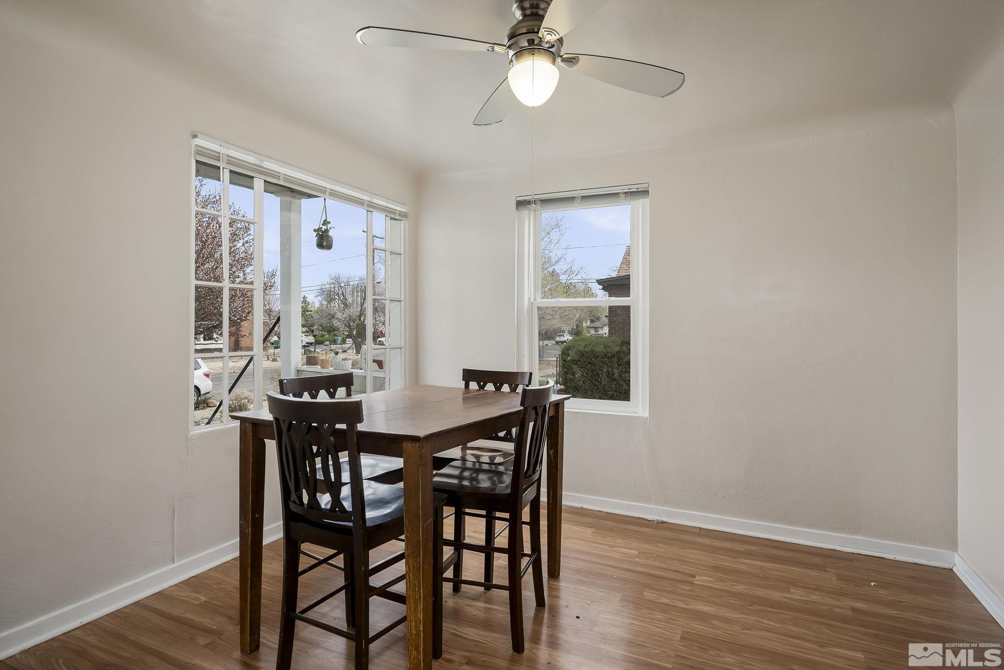 919-915 Bell Street Reno, NV 89503 - Photo 5 of 13 a view of a dining room with furniture and wooden floor