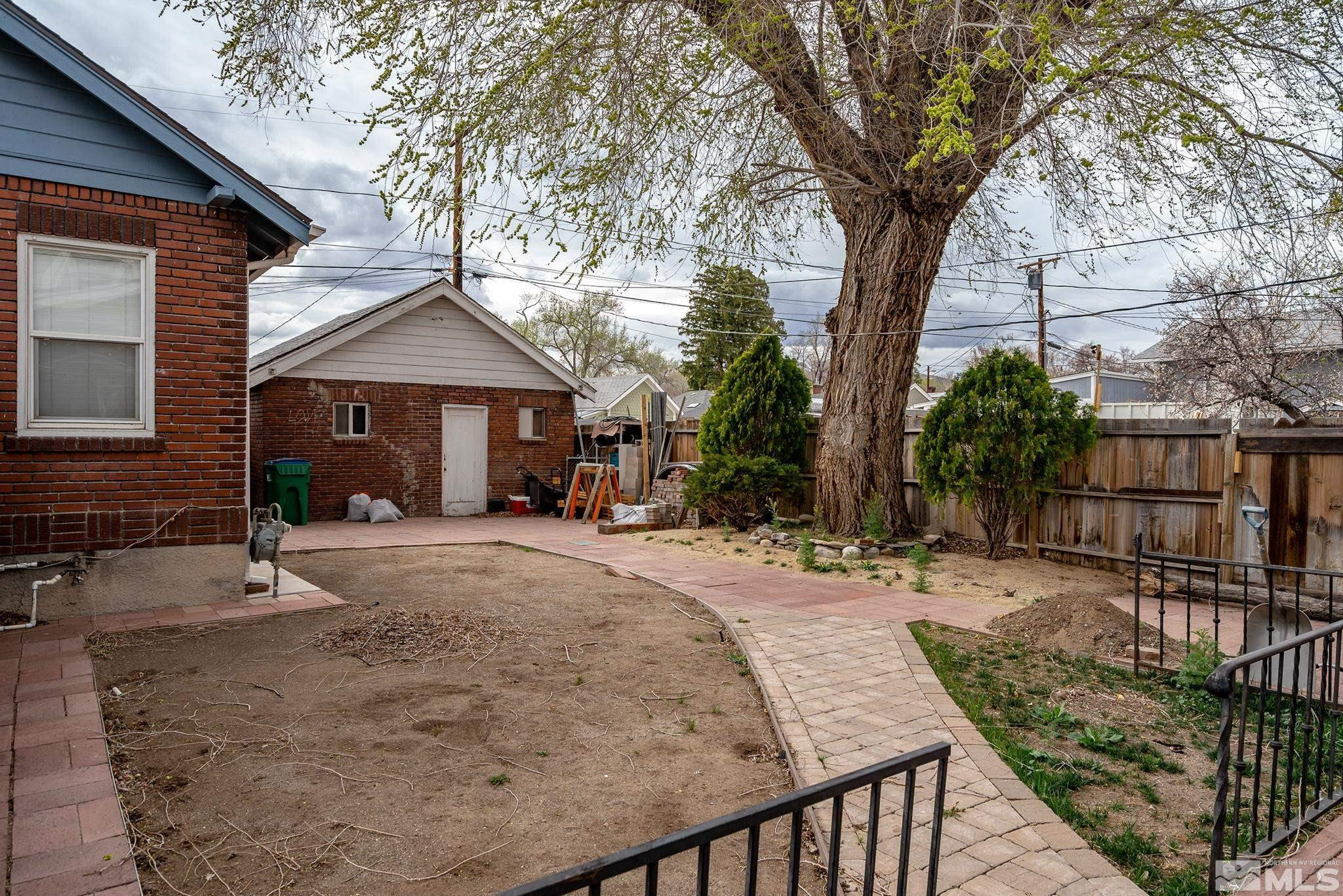 919-915 Bell Street Reno, NV 89503 - Photo 8 of 13 a view of a house with backyard and sitting area