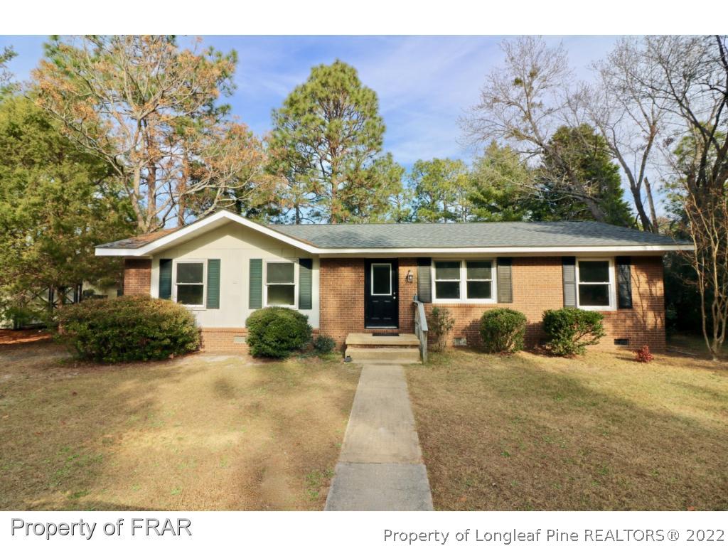 1548 Linden Road Aberdeen, NC 28315 - Photo 1 of 34 a front view of a house with a yard