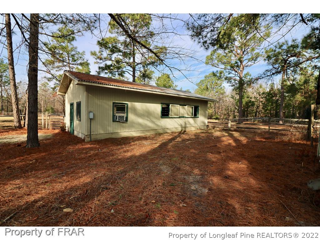1548 Linden Road Aberdeen, NC 28315 - Photo 29 of 34 a view of backyard of house with green space
