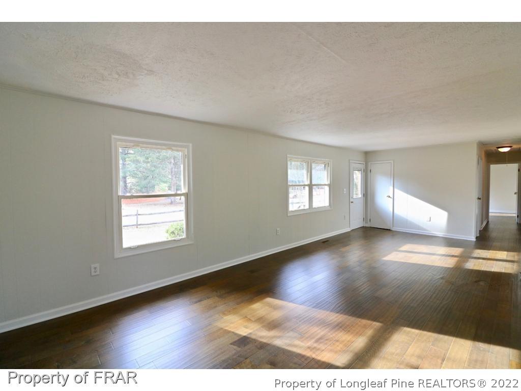 1548 Linden Road Aberdeen, NC 28315 - Photo 9 of 34 a view of an empty room and window