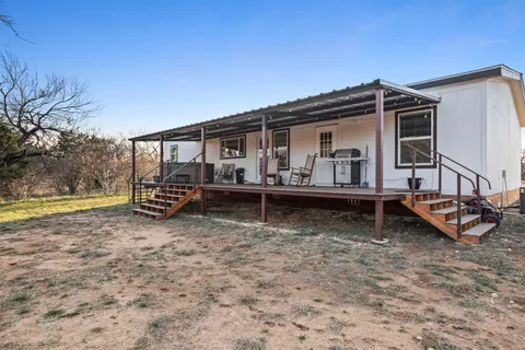 a kitchen with stainless steel appliances granite countertop lots of counter top space a sink and cabinets