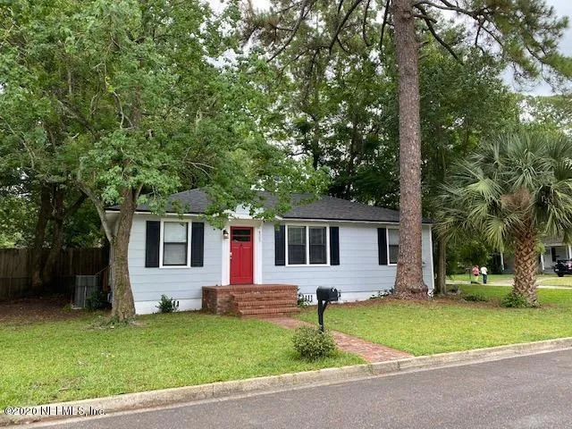 front view of a house with a yard