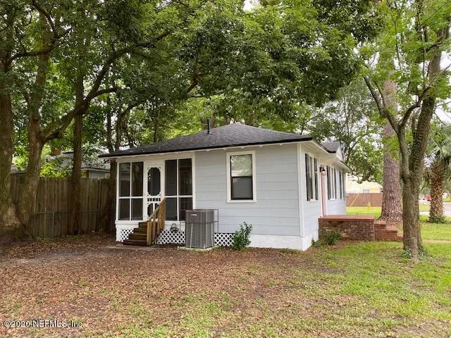 a house with trees in the background