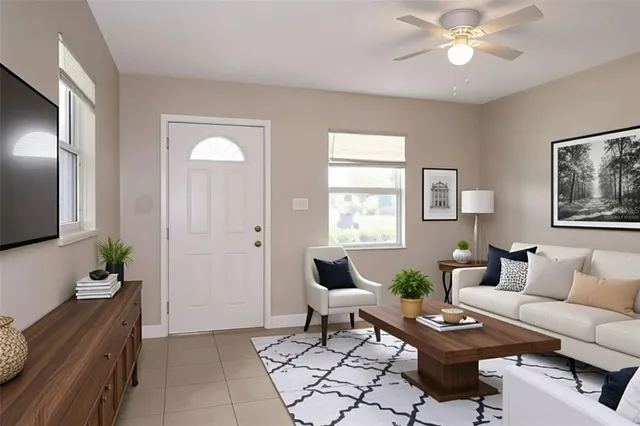 a living room with furniture and wooden floor