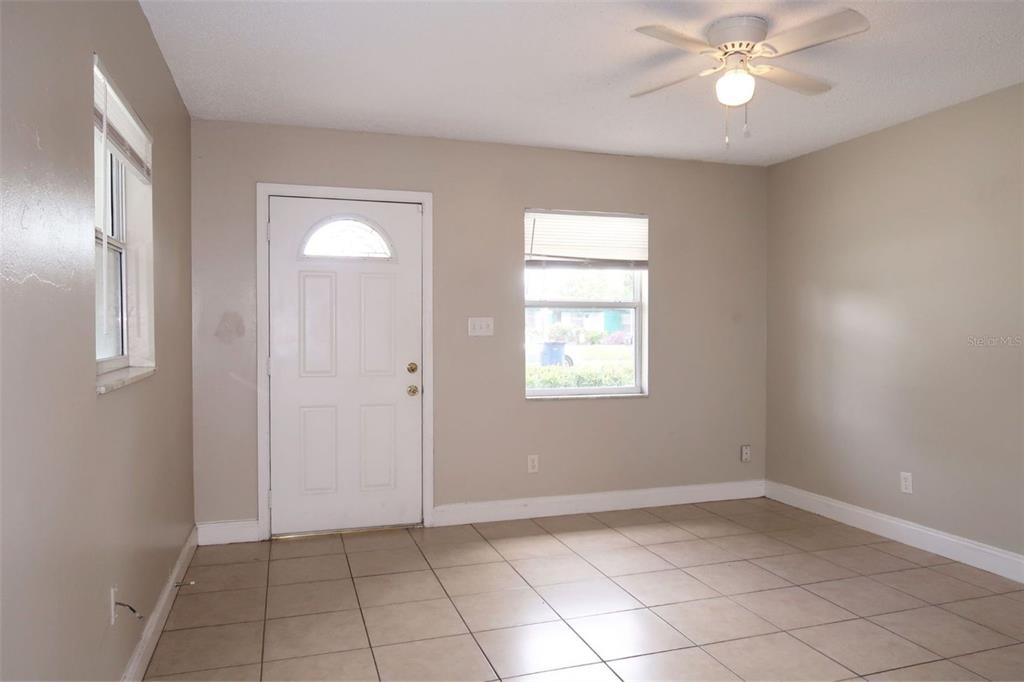 4109 West Arch Street Tampa, FL 33607 - Photo 8 of 14 an empty room with windows and fan