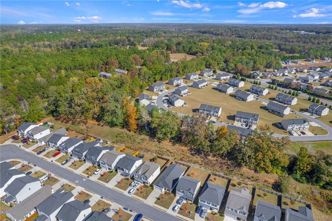 24 Chalet Court Anderson, SC 29621 - Photo 39 of 39 This elevated view captures a serene residential community nestled amidst lush, expansive greenery.