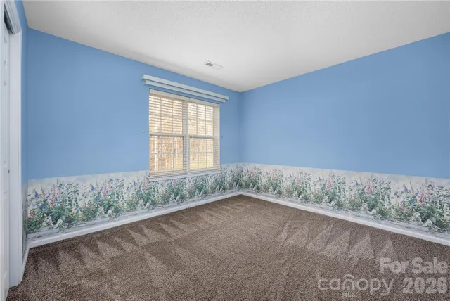 an empty room with a natural light