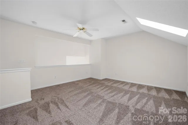 a view of a backyard with large trees