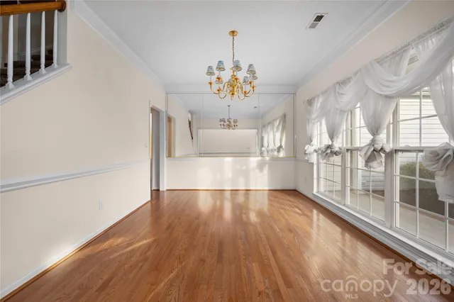 a view of an entryway with wooden floor