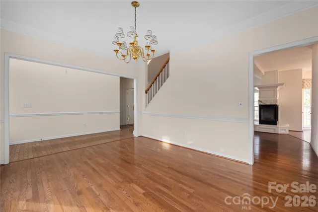a view of an entryway with wooden floor